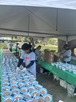 volunteers preparing breakfast items for Women's Fitness Festival runners