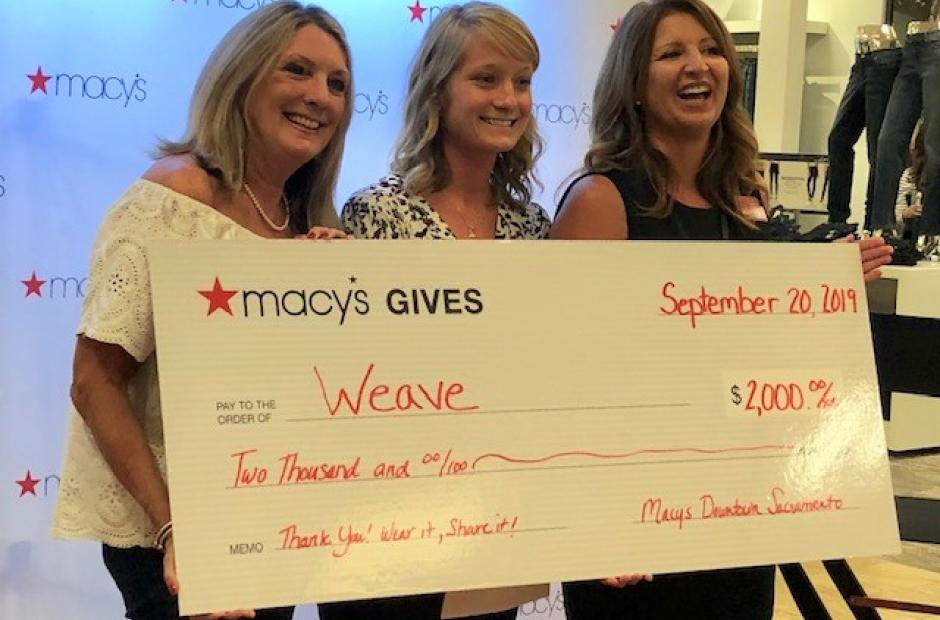 WEAVE team accepting check from Macy's 